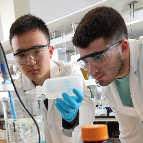 Two students working in a lab